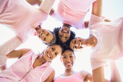 women-wearing-pink-breast-cancer-with-arms-around